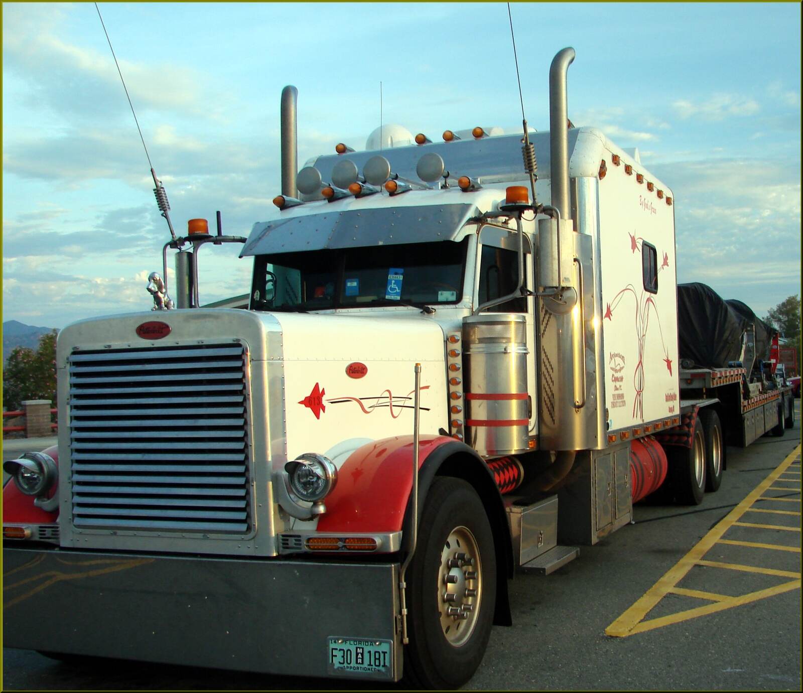 A Peterbilt semi truck tractor parked along a highway in Arizona